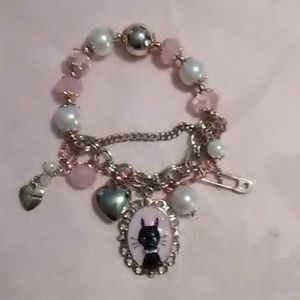 Adorable Betsey Johnson pink and gold cat bracelet